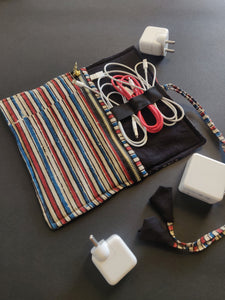 Sooti charger wrap can accommodate three mobile chargers. One can wrap earphones too in the band which is elasticated.  Sooti handmade charger wrap is a perfect travel accessory to keep belongings of your gadgets in one place.